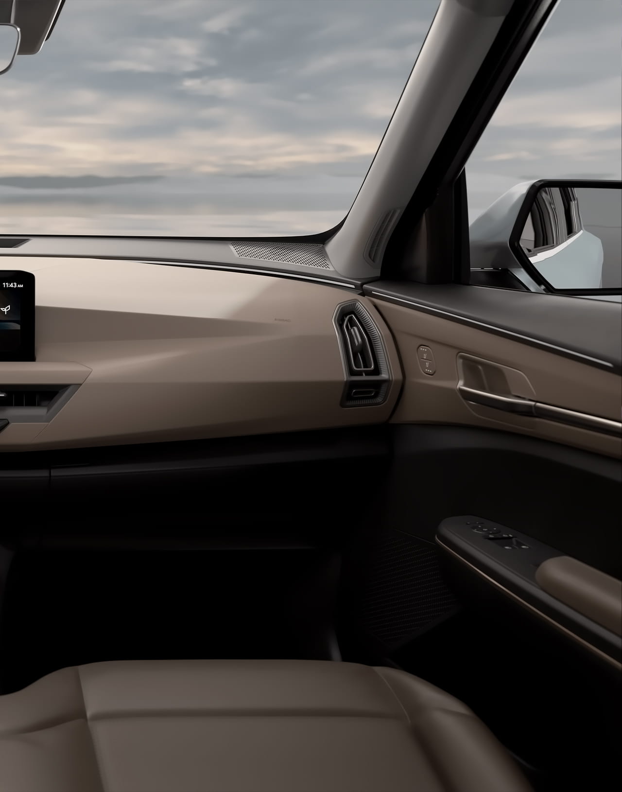 Вид из салона Kia EV5 530 Air, с комфортным передним сиденьем, современными элементами управления и боковыми зеркалами, обеспечивающими отличную видимость и стильный интерьер.